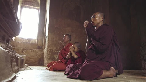 Authentic real monks In Bagan Mayanmar / Burma doing meditation in ancient templ Stock Footage 201096677