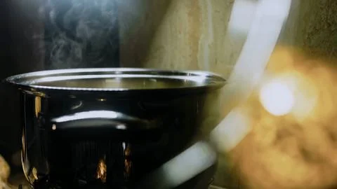 Authentic recipe process: boiling potatoes until tender Stock Photos