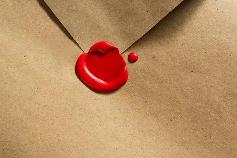 Authentic Retro Mailing: Hand-Sealed Brown Envelope with Wax Heart Detail Stock Photos
