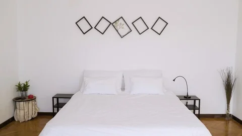 Authentic room with bed made and every day itens on the table. Stock Footage 102653974