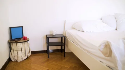 Authentic room with undone bed and every day itens on the table. Stock Footage 102657298