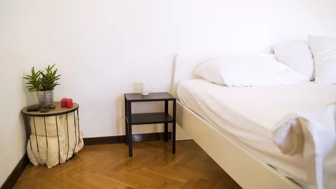 Authentic room with undone bed and every day itens on the table. Stock-Footage 102657343