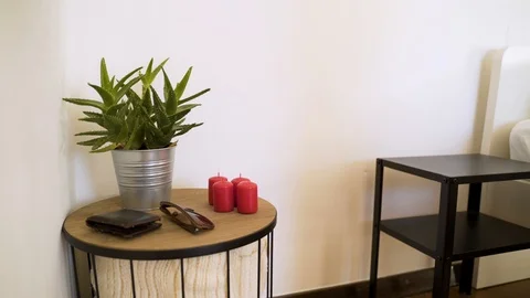 Authentic room with undone bed and every day itens on the table. Video stock 102657565