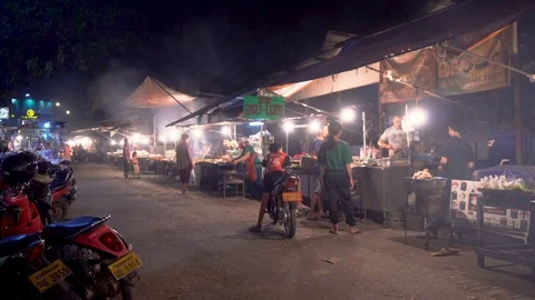 Authentic Rural Small Town Night Market With Street Food Stands in Laos Stock Footage 128653979