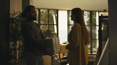 Authentic scene of partners holding keys to their first home Stock Photos