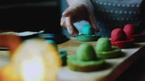 Authentic serving sequence of colored cookie pieces arranged for assembly Stock Footage 342155776