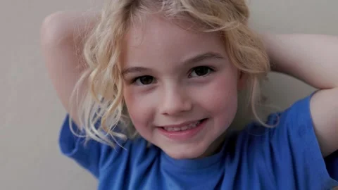 Authentic shot of child kid smiling on camera outdoors Stock Footage 234143961