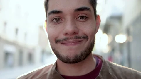 Authentic shot of hipster young man looking and smiling at camera Stock Footage 168250685