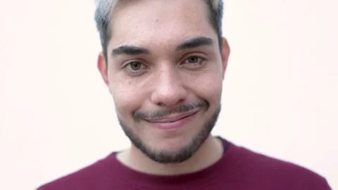 Authentic shot of hipster young man looking and smiling at camera Stock Footage 170248713
