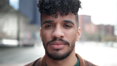 Authentic shot of Latin man looking at camera outdoor Stock Footage 201693571