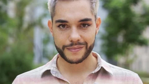 Authentic shot of transgender young man smiling on camera outdoor in the city Video stock 160991935