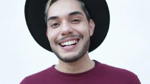 Authentic shot of young hipster man smiling on camera outdoor Stock Footage 164227640