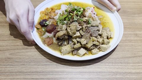 Authentic steamed rice noodle rolls with tofu, mushrooms, Chinese sausage, .. Stock Footage 344029677