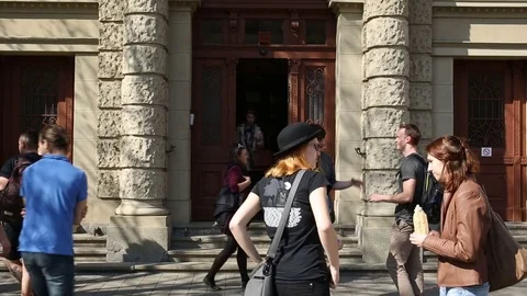 Authentic students leave University in Brno, walking before school Stock Footage 74620154
