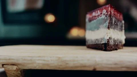 Authentic sweet serving view: showing a strawberry jelly cake slice Stock Photos