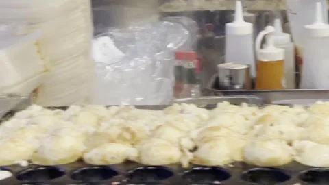 Authentic Takoyaki Preparation - Close-Up View Stock Footage 243842896