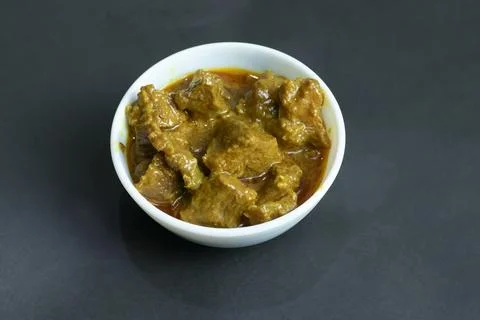 Authentic taste of beef curry, a culinary delight presented in a clean, mod.. Stock Photos