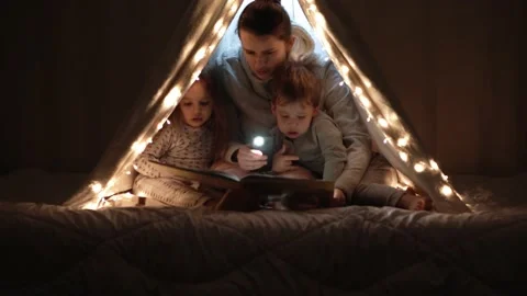 Authentic tender cute mom and preschool kids boy and girl in tent at home. young Stock Footage 146487321