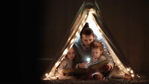 Authentic tender cute mom and preschool kids boy and girl in tent at home. young Stock Footage 146487488