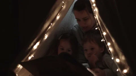 Authentic tender cute mom and preschool kids boy and girl in tent at home. young Stock Footage 146669114