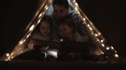 Authentic tender cute mom and preschool kids boy and girl in tent at home. young Stock Footage 146711731