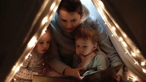 Authentic tender cute mom and preschool kids boy and girl in tent at home. young Stock Footage 146711806