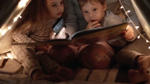 Authentic tender cute mom and preschool kids boy and girl in tent at home. young Stock Footage 147293240