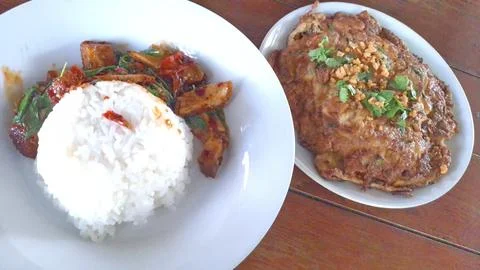 Authentic Thai Basil Crispy Pork with Rice and Minced Pork Herb Omelet Stock Photos