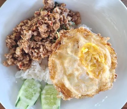 Authentic Thai Basil Minced Pork with Rice and Crispy Fried Egg Top Stock Photos