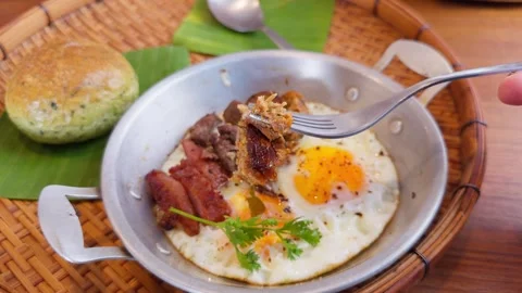 Authentic Thai Breakfast "Kai Krata" - Pan-Fried Eggs with Mixed Grilled Meats Stock Footage 335520562