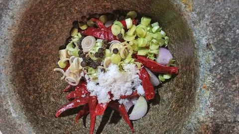 Authentic Thai Curry Paste Ingredients in a Traditional Stone Mortar Stock Photos