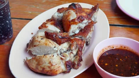Authentic Thai Grilled Chicken with Spicy Dipping Sauce Stock Footage 335520542