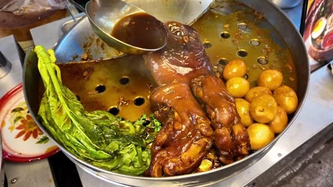 Authentic Thai Pork Leg Stew With Eggs and Greens at Phuket Street Food Market Video stock 335580787