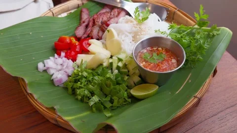 Authentic Thai Rice Noodle Salad with Grilled Pork and Spicy Dressing Stock Footage 335520543