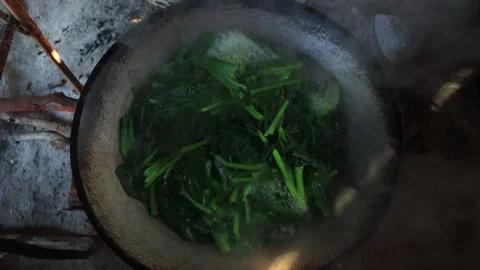 Authentic Thai Rural Cooking with Fresh Green Vegetables in Iron Wok Stock Footage 340248232