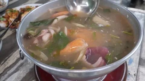 Authentic Thai Seafood Tom Yum Soup in Hot Pot Close-up Stock Footage 338212075