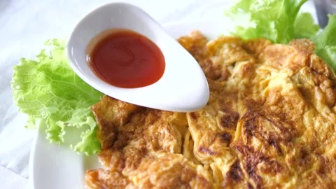 Authentic Thai style omelet with minced pork and chili sauce Video stock 332144788