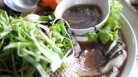 Authentic Thai style steamed Tilapia fish with soy sauce ginger Video stock 332144797