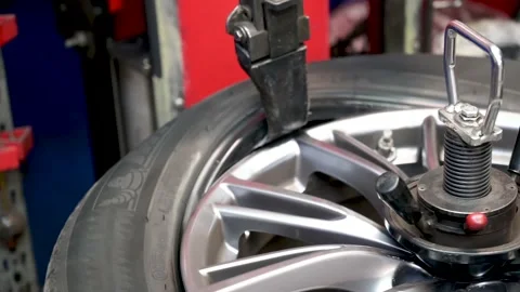 Authentic tire repairer at mechanical work 4k 10 bit Stock Footage 137252654