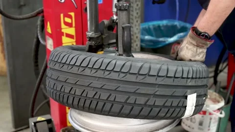 Authentic tire repairer at mechanical work 4k 10 bit Stock Footage 137252662
