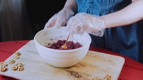 Authentic traditional recipe view: shaping beet pkhali by hand Stock Footage 342200235