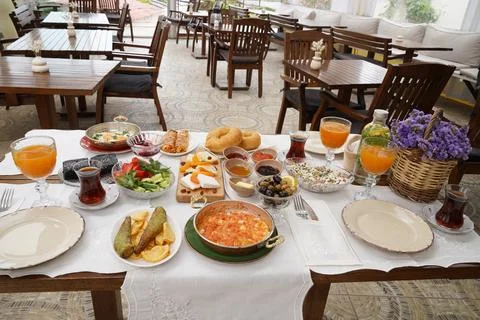 Authentic Turkish Breakfast Spread Served in a Cozy Restaurant Garden Setting Stock Photos