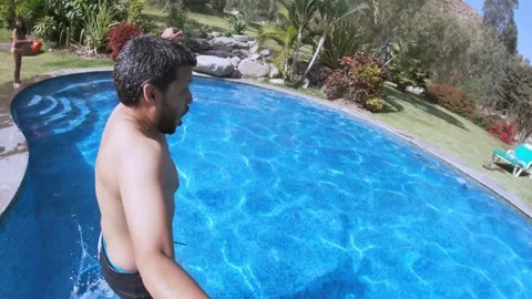 Authentic UGC Man Jumping Into Pool POV Stock Footage 329055179