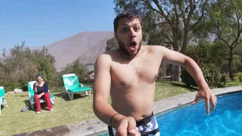 Authentic UGC Man Jumping Into Pool POV Stock Footage 329107127