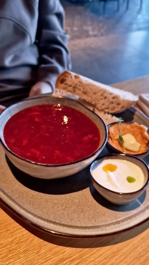 Authentic Ukrainian Borscht Soup Served with Bread and Sour Cream Stock Footage 338992431