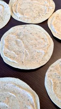Authentic vertical image of burrito's with a white sauce Stock Photos