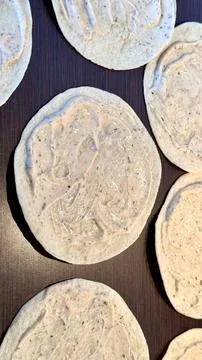 Authentic vertical image of burrito's with a white sauce Stock Photos