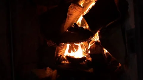 Authentic wood burning with orange flames in the dark. Stock Footage 328799107