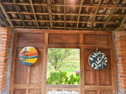 Authentic Wooden Facade with Open Window to Garden and Nature Inspired Wall Art Stock Photos