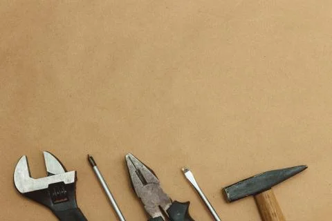 Authentic worn various tools on border with copyspace. flat lay. top view. Stock Photos